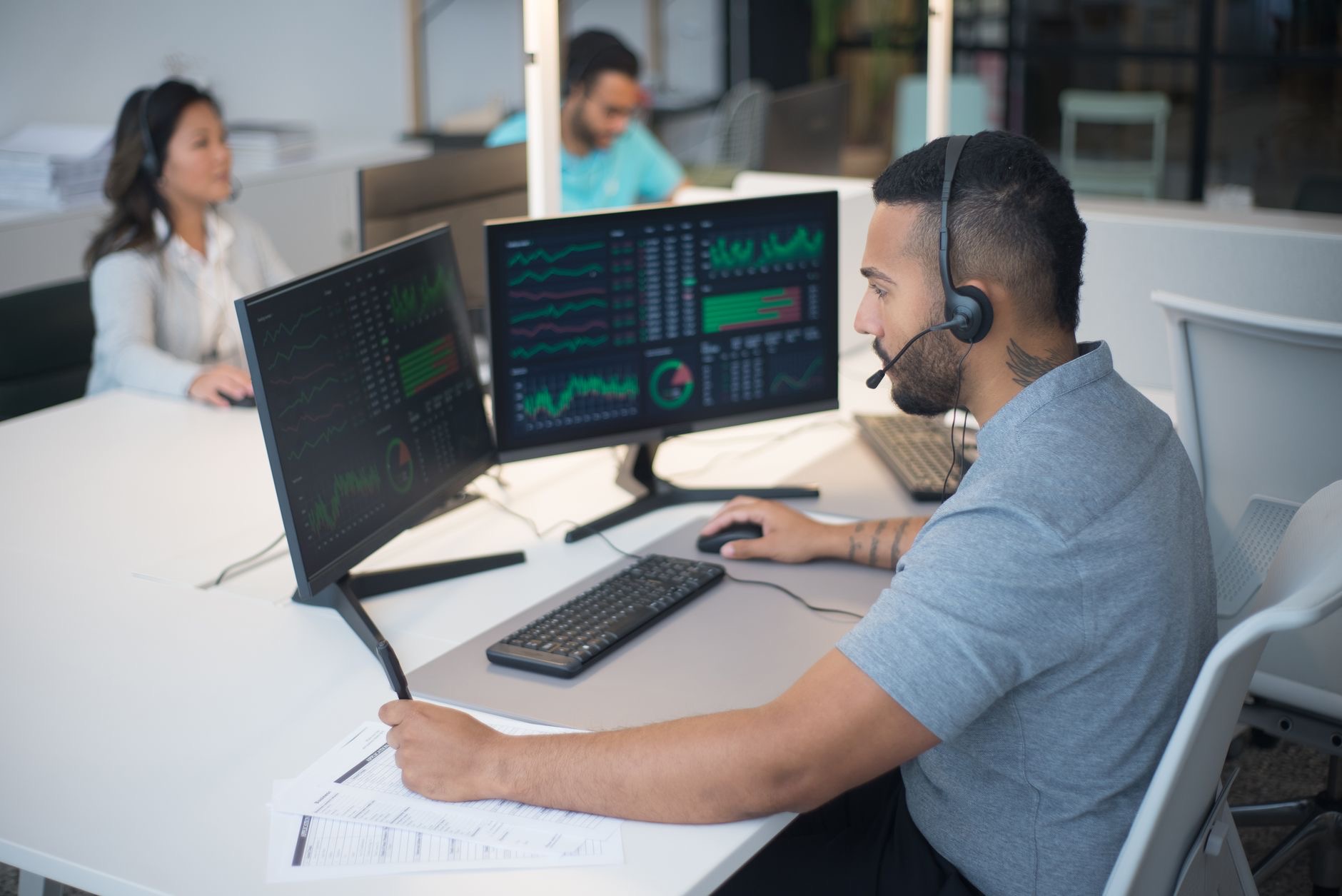cybersecurity operations center analysts computer monitors